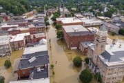 drone photo from above main street in montpelier shows the downtown area completely flooded. All buildings surrounded by up to 5 ft of brown water.